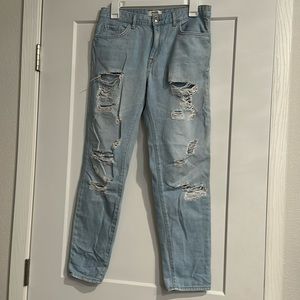 Women’s light wash boyfriend style distressed jeans